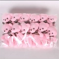 Pack of twelve pink plush teddy bears with brown ribbons in clear plastic packaging - Pink