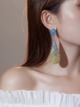 Elegant gradient blue to yellow teardrop earrings with crystals worn by a model - Blue and Gold Gradient