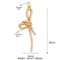 Gold bow pendant with micro-pave white crystals, dimensions 36mm by 14mm, 1.89g weight - Zirconia Bowknot / Gold