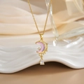 Detail of gold moon pendant with pink stone and teardrop zircon on ceramic decor - Pink Purple Moonstone Drop (XL0308)