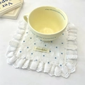 Macro view of white cotton coaster with blue heart pattern and exquisite lace edges - Blue Coaster