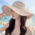 Detail of light pink straw sun hat with large lace bow, pearls and delicate lace trim - Large Brim Pearl Pink