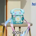 Blue retro telephone shaped water bottle for kids with colorful strap and 3D charms - 400ml / Blue