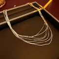 Collana a strati dorata a maglia serpente con catene multiple e ciondolo a goccia - Oro