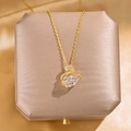 Elegant gold-plated swan pendant necklace with micro-pave zircons on luxury jewelry box - Gold Zirconia Swan Necklace