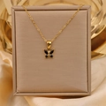 18K vergulde titanium ketting met zwarte zirkoon vlinderhanger op zijden achtergrond - Goud + Zwart