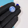 Sparkling blue round clay bead with rhinestone inlay held by a gloved hand for DIY jewelry - 16mm AB Sea Blue Round Bead