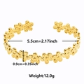 Detail view of 18k gold floral cuff bracelet with 5.5cm inner diameter and 0.9cm width - Gold