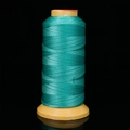 Durable cyan-blue braided nylon thread for jewelry making on a yellow spool - Autumn Green