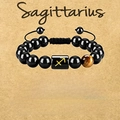 Adjustable Sagittarius zodiac bracelet with tiger eye stone and black beads on vintage card - Sagittarius