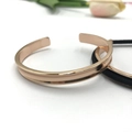Minimalist rose gold stainless steel open bangle with unique curved groove design - Arc Rose Gold