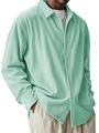Detail of mint green corduroy texture and button-down collar on men's long sleeve shirt - Light Green