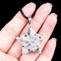 Star-shaped necklace featuring a speckled natural white granite stone pendant with black cord - 30mm Kiwi Stone