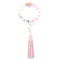 Close-up of pink and marble silicone bead keychain with wood bead and PU leather tassel - Style 7 (Pink Marble Tassel)
