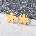 Macro shot of 18K gold plated stainless steel five-petal flower stud earrings on white stone - Redbud Flower / Gold