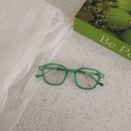 Top view of translucent green acetate frames for kids with metal dot details - Transparent Green