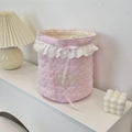 Close-up of pink quilted fabric storage basket featuring lace trim and a heart applique - Light Pink Heart Cartoon