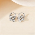 Polished silver titanium steel earrings with abstract petal pendants and hoop closures - Four-leaf Flower / Steel