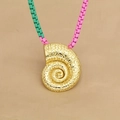 Golden conch pendant beaded necklace with pink and green accents on beige fabric - Pink Green Chain Conch (D)