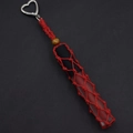 Close-up of handmade red woven lipstick pouch with heart clip and wooden bead detail - Red