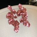 Detailed macro shot of pink petal-shaped tassel drop earrings with a pearly matte finish. - Steel Earring Post (22#)
