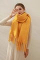 Soft bright yellow mohair knit scarf with chunky tassels for winter warmth - Turmeric