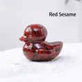 Duck carving made of natural red sesame stone with polished finish and spotted texture - Red Sesame