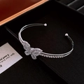 Detail of silver butterfly cuff bracelet with sparkling cubic zirconia on a jewelry box - Silver