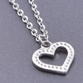 Macro shot of silver heart pendant with sparkling crystals on a textured dark background - Steel Color + Necklace Chain