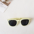 Foldable cream yellow vintage sunglasses for toddlers with black lenses on white background - Yellow