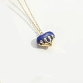 Macro shot of royal blue heart pendant with golden base and fine link chain - Royal Blue