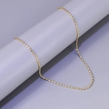 Detailed close-up of golden stainless steel ball bead chain draped on a grey cylinder - L206-Bead Chain / Gold