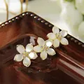 Rhinestone floral spring hair clip with three pearlescent petals and gold finish - 6cm Opal Lily Rhinestone Spring Clip