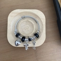 Silver beaded bracelet with heart, bow, and star charms on a braided steel cable band - Black Bow Bracelet