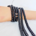Polished 8x5mm black glass abacus beads layered as a multi-strand beaded bracelet - 5*8mm Approx 75pcs per strand / Polished Black Agate