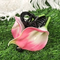 Close-up of a pink calla lily hair claw clip with black base on green grass - Rose Red Calla Lily / 16cm/1PC