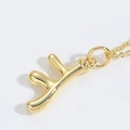 Collana con ciondolo lettera F dorata lucida con estetica vintage sole e stivale - Corna di Cervo (ai-Antler)