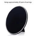 Oval black velvet jewelry stand with pearl trim holding approximately 20 pairs of earrings - Medium / Black Velvet