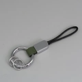 Porte-clés créatif en argent avec boucle en cuir vert et lanière tressée noire - Vert + Argent