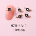 Macro shot of 10x4mm heart-shaped alloy nail charms with black zircon and gold base - Gold Black Style (AB42) / 10 Pieces Pack