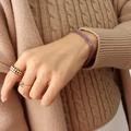 Retro jewelry set featuring purple gemstone bracelet and black geometric rings - Purple Zirconia Bracelet