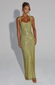 Detailed view of the sparkling sequin mesh fabric on a backless green party dress - S / Green