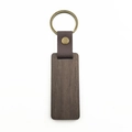 Detail of dark walnut wood keychain with brown leather strap and brass metal ring - Rectangular Walnut Wood