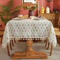 French vintage floral tablecloth with tassels on a rectangular beige dining table - 140*260cm / Green Plants With Tassels