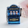 Portachiavi mini slot machine blu metallizzato con rulli di frutta girevoli - Blu Galvanizzato