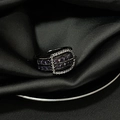 Macro detail of belt buckle ring featuring purple gemstones on black satin fabric - Adjustable Open / Black Belt Buckle Purple Gem