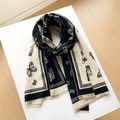 Close-up of beige and black scarf with elegant butterfly print and fringe details - 185x65cm / Black