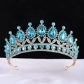 Golden baroque bridal crown with blue teardrop rhinestones on white silk background - KC Gold With Full Lake Blue Stones