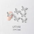 Macro detail of 3D silver butterfly nail charms with micro-rhinestones and size 10x13mm - Silver Sparkling Full Drill Butterfly (7192)