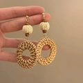 Bohemian style rattan drop earrings with wooden beads and woven cotton ball details - Woven Ball Wood Bead Round Style